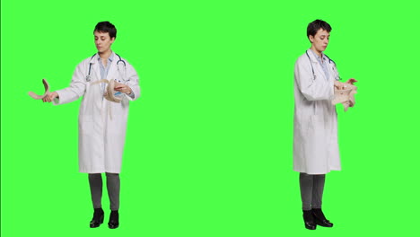 Orthopedics-specialist-holding-a-cervical-neck-collar-against-greenscreen
